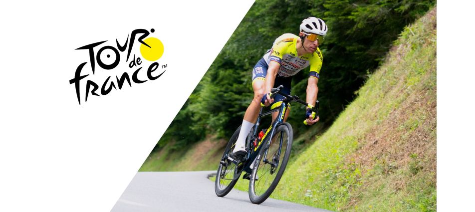 Picture of a member of the UCI Intermarché-Circus-Wanty team on a bend. Tour de France logo