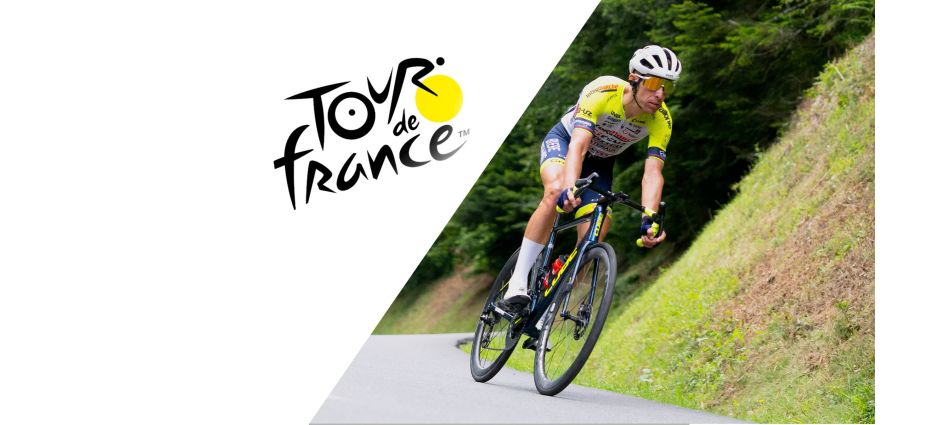 Picture of a member of the UCI Intermarché-Circus-Wanty team on a bend. Tour de France logo